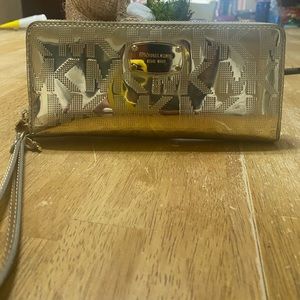 Authentic Michael Kors wallet/ wristlet. Chrome gold.